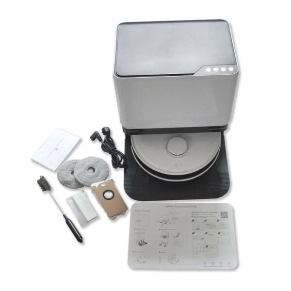 A Glider Robot Vacuum and Mop and its accessories. The main unit is white with a black base. Accessories include two round mop pads, a brush, a charging cable, a cardboard filter, a user manual, and an additional bag. The setup instructions are displayed on a laminated sheet.