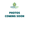 A green background with the HomeBot Ireland logo at the top, featuring a house outline with a smiley face inside. Below the logo, bold blue text reads "PHOTOS COMING SOON."