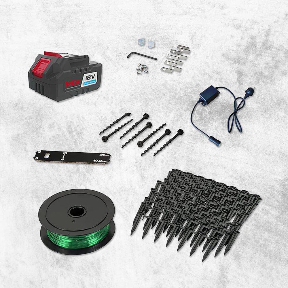 A set of spare parts for robot lawn mowers. Including an 18V battery, screws, brackets, a power lead, saw blade, spool of boundary wire, and numerous black plastic pegs arranged neatly on a grey surface.